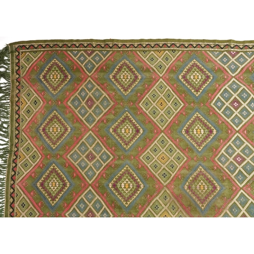 1107 - Rectangular Turkish Kilim green ground rug, 250cm x 155cm