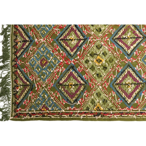 1107 - Rectangular Turkish Kilim green ground rug, 250cm x 155cm