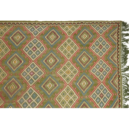 1107 - Rectangular Turkish Kilim green ground rug, 250cm x 155cm