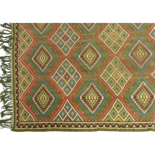 1107 - Rectangular Turkish Kilim green ground rug, 250cm x 155cm