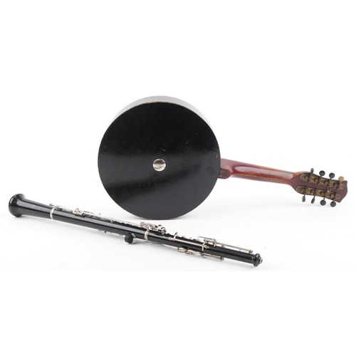 1204 - Reliance eight string banjolele and a Boosey & Hawkes three piece oboe, both with cases, the largest... 