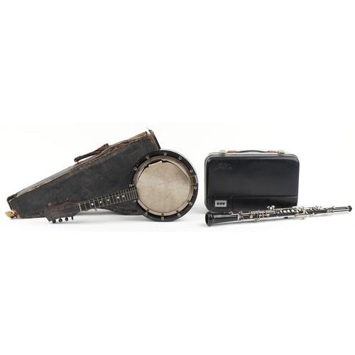 1204 - Reliance eight string banjolele and a Boosey & Hawkes three piece oboe, both with cases, the largest... 