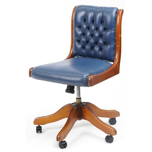 1038 - Mahogany and blue leather button back upholstered adjustable desk chair, 89cm high