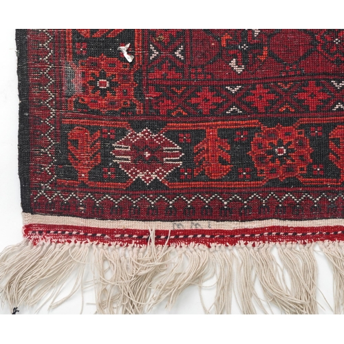 1109 - Rectangular Bokhara red ground carpet runner, 300cm x 82cm