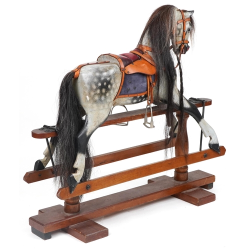 1002 - Stevenson Brothers gesso dapple grey rocking horse on stand, 96cm high x 104cm in length