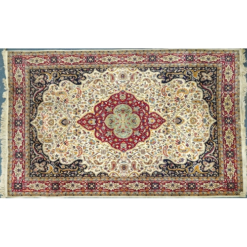 1106 - Rectangular Persian cream and red ground rug having an all over repeat floral design, 370cm x 270cm