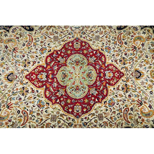 1106 - Rectangular Persian cream and red ground rug having an all over repeat floral design, 370cm x 270cm