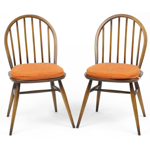 1035 - Two Ercol stick back dining chairs with cushioned seats, each 83cm high