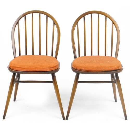 1035 - Two Ercol stick back dining chairs with cushioned seats, each 83cm high