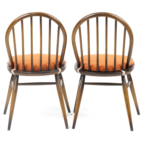 1035 - Two Ercol stick back dining chairs with cushioned seats, each 83cm high