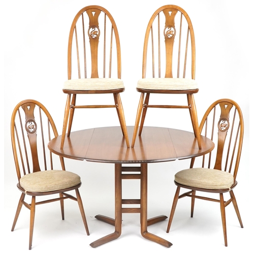 1062 - Ercol elm drop leaf dining table with four chairs carved with swans, the table 74cm H x 63cm W x 111... 