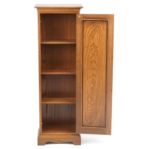 1039 - Ercol elm cupboard enclosing three adjustable shelves, 122.5cm H x 40.5cm W x 24cm D