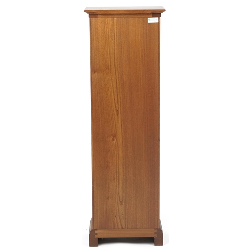 1039 - Ercol elm cupboard enclosing three adjustable shelves, 122.5cm H x 40.5cm W x 24cm D