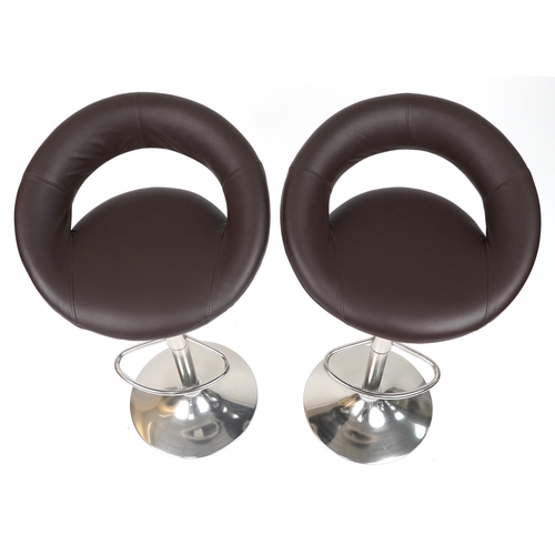 1007 - Contemporary chrome breakfast table with circular glass top and pair of adjustable stools with brown... 