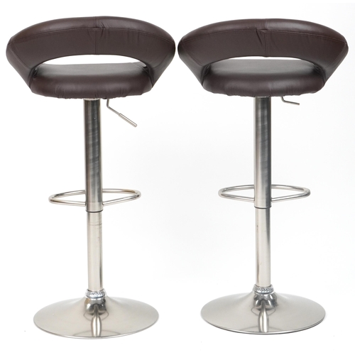 1007 - Contemporary chrome breakfast table with circular glass top and pair of adjustable stools with brown... 