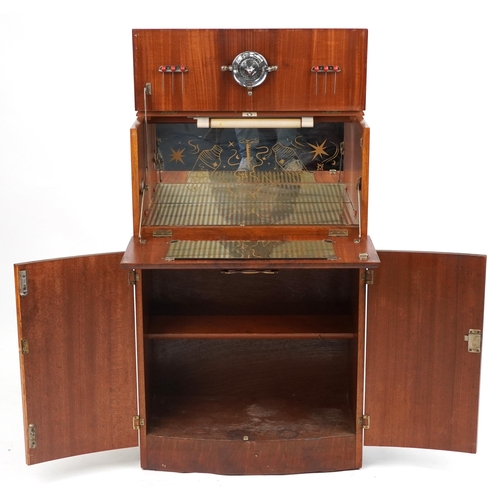 1069 - Art Deco walnut cocktail cabinet fitted with a fall enclosing a mirrored interior above a cupboard b... 