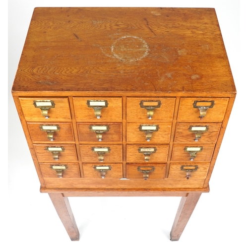 1060 - Libraco, oak sixteen drawer haberdashery chest on stand, 128.5cm H x 66cm W x 50cm D