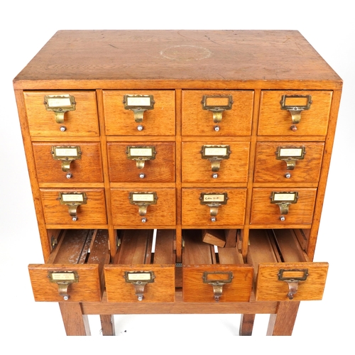 1060 - Libraco, oak sixteen drawer haberdashery chest on stand, 128.5cm H x 66cm W x 50cm D