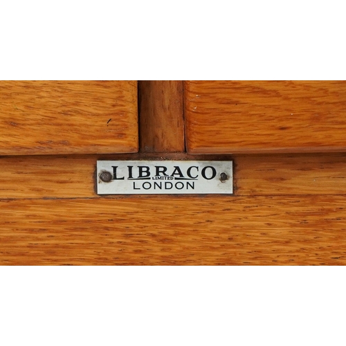 1060 - Libraco, oak sixteen drawer haberdashery chest on stand, 128.5cm H x 66cm W x 50cm D