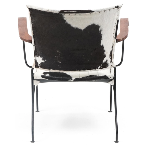 1078 - Brutalist style wrought iron and cow hide armchair, 75cm high