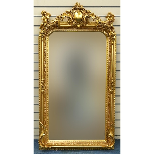 1115 - Large ornate gilt framed mirror having bevelled glass mounted with Putti musicians and swags, 62cm x... 