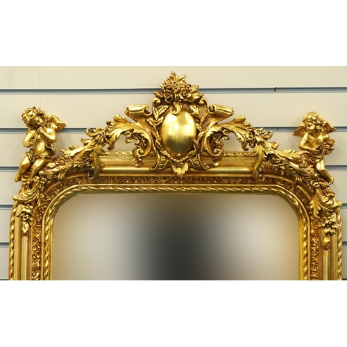 1115 - Large ornate gilt framed mirror having bevelled glass mounted with Putti musicians and swags, 62cm x... 