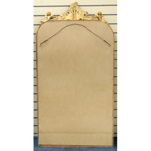 1116 - Large ornate gilt framed mirror having bevelled glass mounted with Putti and swags, 62cm x 84cm