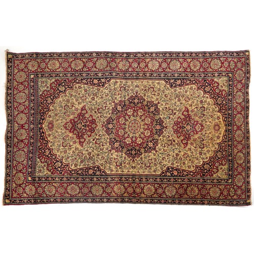 1108 - Rectangular Persian red ground rug having and allover repeat floral design, 227cm x 141cm