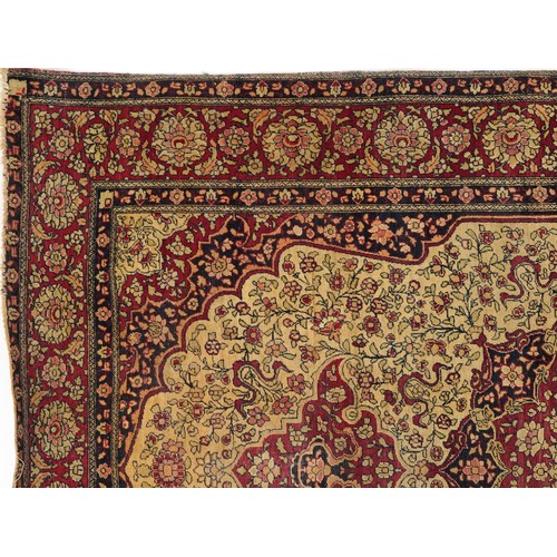 1108 - Rectangular Persian red ground rug having and allover repeat floral design, 227cm x 141cm