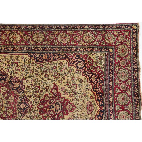 1108 - Rectangular Persian red ground rug having and allover repeat floral design, 227cm x 141cm