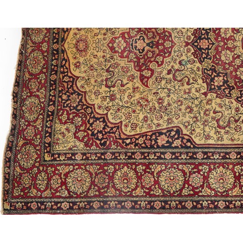 1108 - Rectangular Persian red ground rug having and allover repeat floral design, 227cm x 141cm