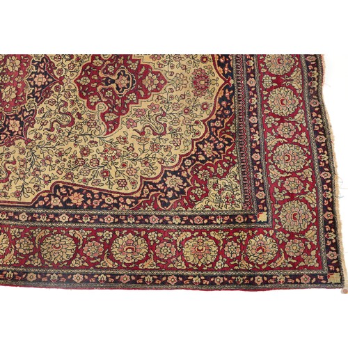 1108 - Rectangular Persian red ground rug having and allover repeat floral design, 227cm x 141cm