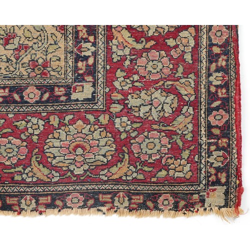 1108 - Rectangular Persian red ground rug having and allover repeat floral design, 227cm x 141cm