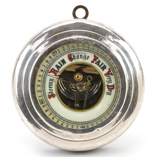 105 - George V circular silver mounted mahogany wall barometer having enamelled dial with Arabic numerals,... 