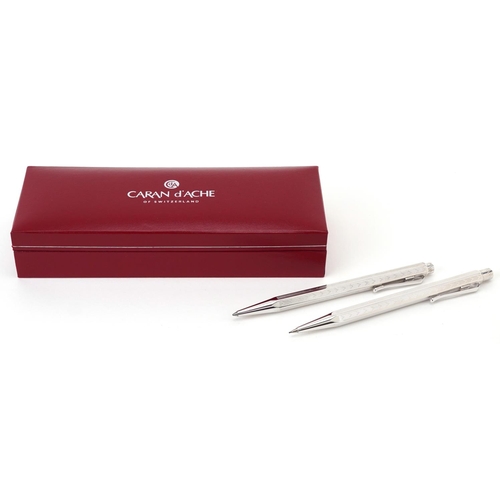 202 - Carin D'Ache, Swiss engine turned propelling pencil and ballpoint pen with fitted case