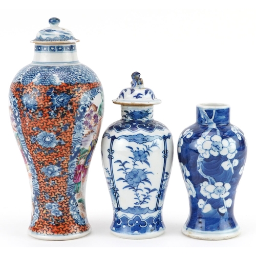 214 - Three Chinese porcelain baluster vases with two covers including a Mandarin example hand painted wit... 