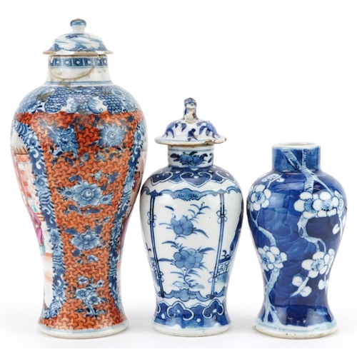 214 - Three Chinese porcelain baluster vases with two covers including a Mandarin example hand painted wit... 