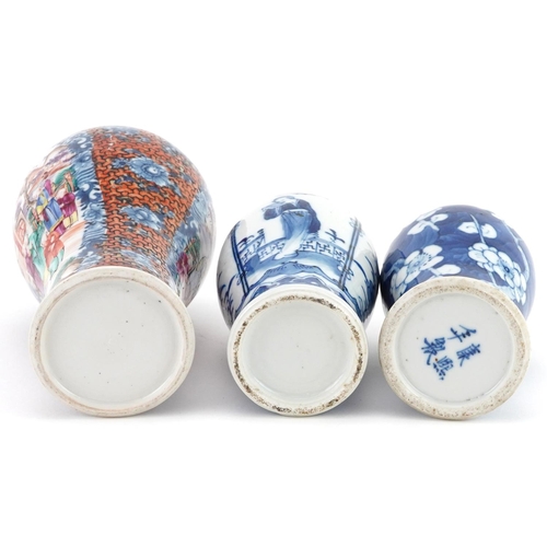 214 - Three Chinese porcelain baluster vases with two covers including a Mandarin example hand painted wit... 