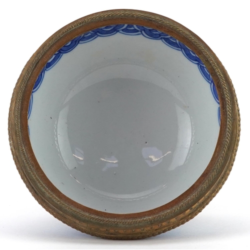 219 - Japanese Nabeshima blue and white porcelain bowl with gilt brass mounts, 11.5cm high