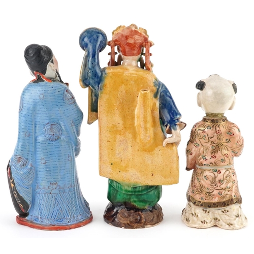 1382 - Three Chinese and Japanese figures including a Satsuma example of a young boy, the largest 23.5cm hi... 