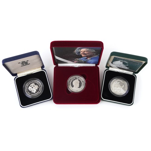 1669 - Three silver proof coins with cases including 2007 Britannia two pound and Memorial crown