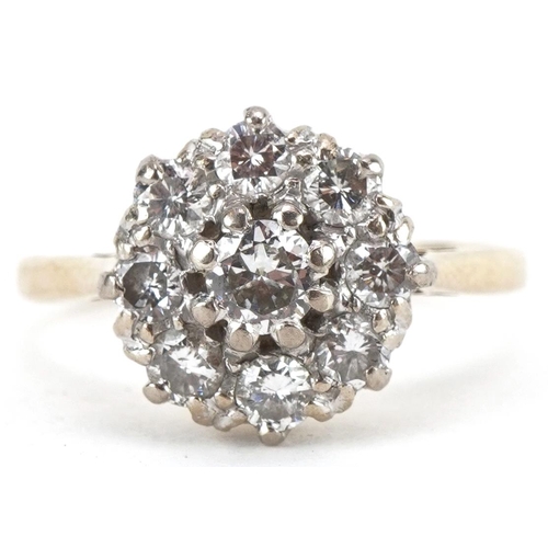 2033 - 18ct gold diamond cluster ring, the central diamond approximately 0.20 carat, size N, 3.6g