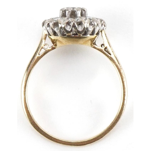 2033 - 18ct gold diamond cluster ring, the central diamond approximately 0.20 carat, size N, 3.6g