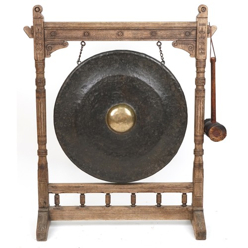 1021A - Large Antique Tibetan patinated bronze monastery gong on later oak stand, overall 121cm high x 100cm... 