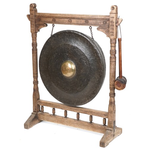 1021A - Large Antique Tibetan patinated bronze monastery gong on later oak stand, overall 121cm high x 100cm... 