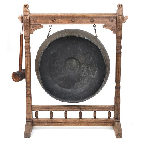 1021A - Large Antique Tibetan patinated bronze monastery gong on later oak stand, overall 121cm high x 100cm... 