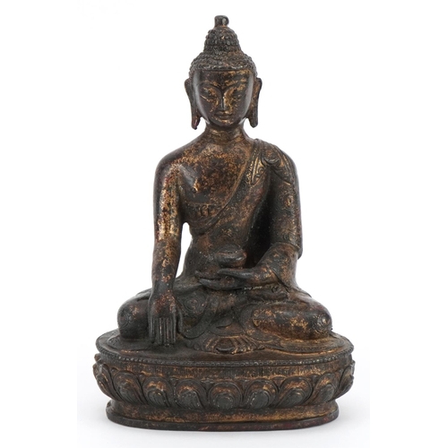 221 - Chino Tibetan partially gilt bronze figure of seated Buddha, 20.5cm high