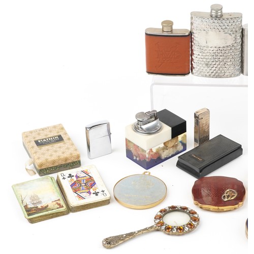 1457 - Sundry items including a marine table lighter, hip flasks, compact and vintage playing cards, the la... 