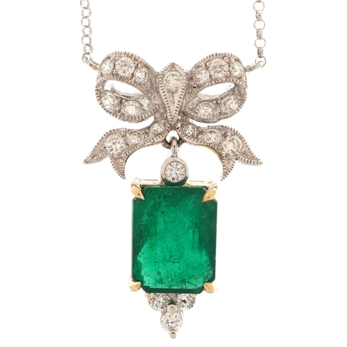 2050 - 18ct white and yellow gold diamond and emerald pendant in the form of a bow on an 18ct white gold ne... 