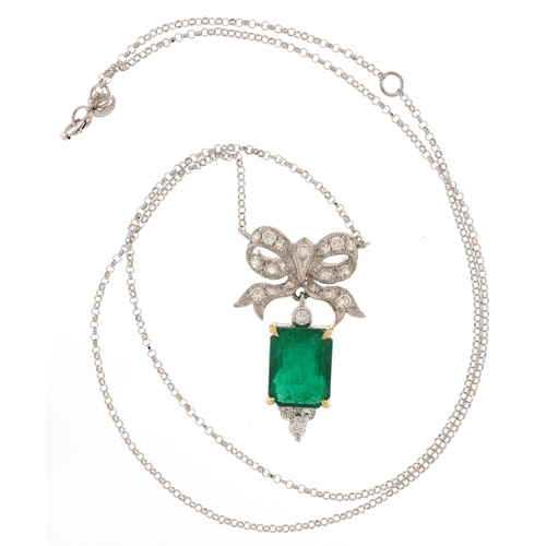 2050 - 18ct white and yellow gold diamond and emerald pendant in the form of a bow on an 18ct white gold ne... 